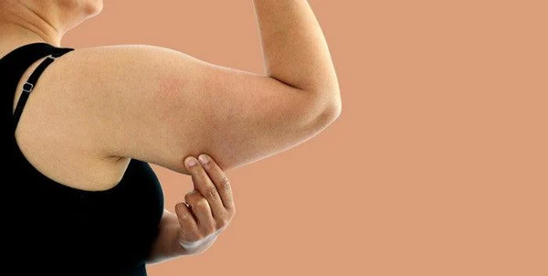 Toning Bingo Wings: Your Ultimate Guide to Sculpting Sleek Arms at the Gym 1 Woman doing push-ups for arm strength Scotland