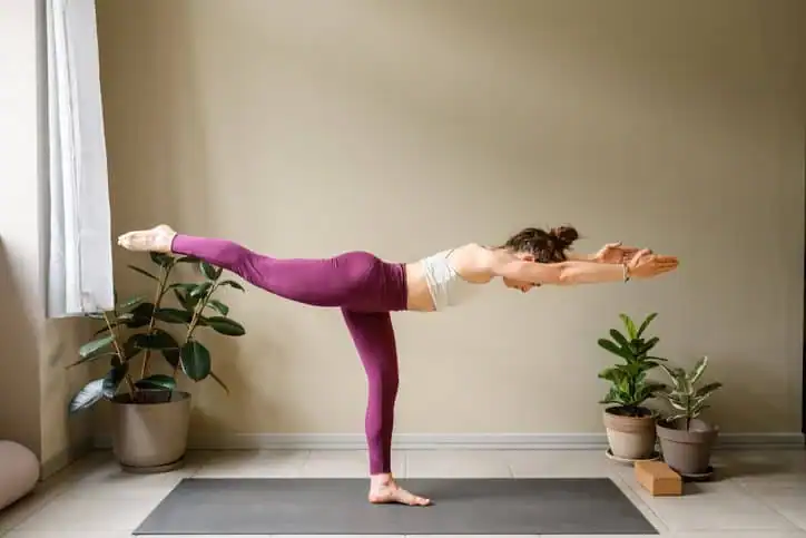 Woman doing Yoga exercise Scotland to help with toning the body. 