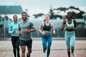 Sculpting Sleek Arms: The Essential Role of Cardio in Toning Without Bulking Up 3 image of people running to incorporate cardio Scotland exercise into their life to help tone arms and body.